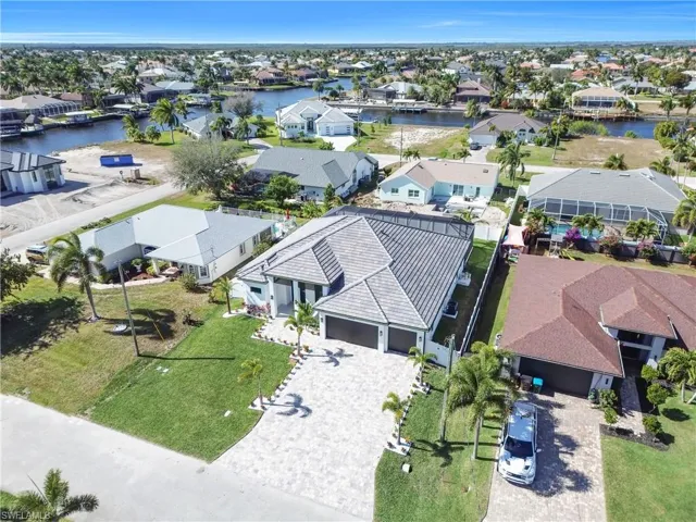 Aerial view of residential area featuring a large body of water