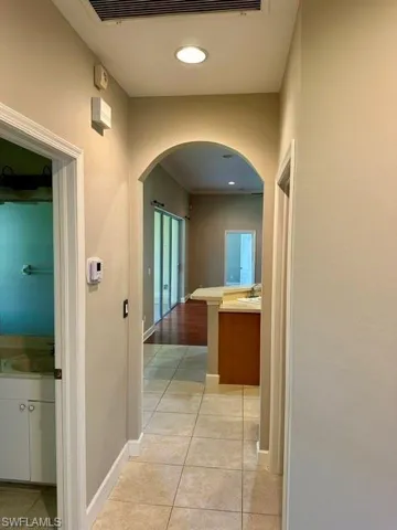 Hallway featuring sink and light hardwood / wood-style floors