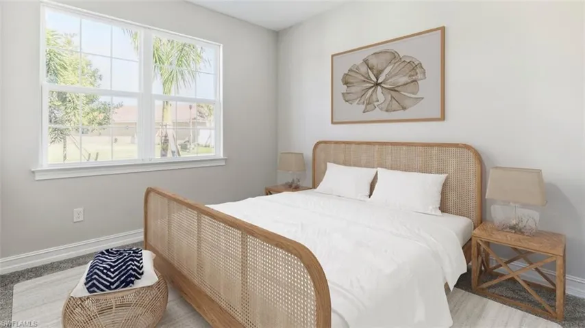 This image is virtually staged. Bedroom featuring baseboards and carpet