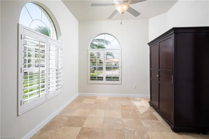 Den with gorgeous arched windows and plenty of natural light.