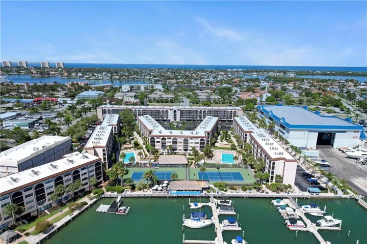 Birds eye view of property with a water view