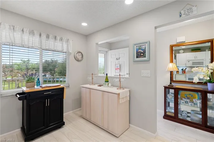 Kitchen featuring white appliances and a textured ceiling