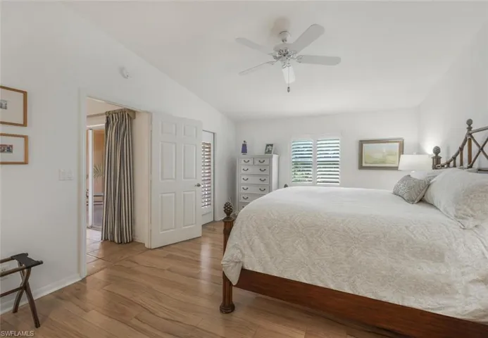 Primary Bedroom featuring a ceiling. fan, vaulted ceiling