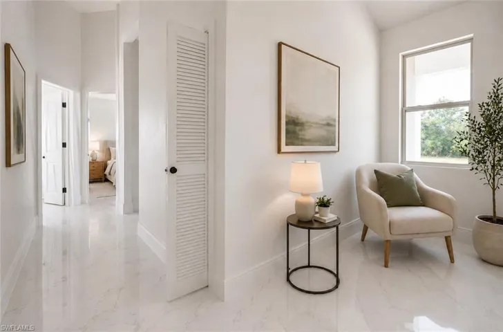 Bright interior space featuring white walls and white tile flooring. Image digitally enhanced and virtually altered; actual property condition may differ.