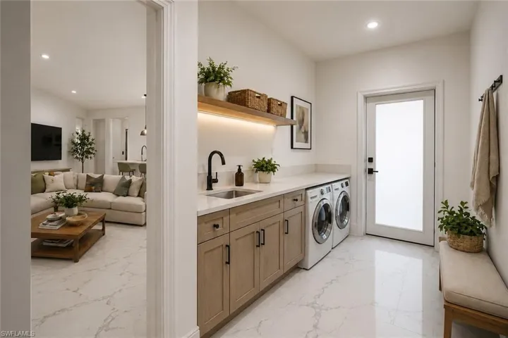 Utility room featuring a built-in sink with a black faucet, light wood-finish cabinetry, under-shelf lighting, and white appliances. Image digitally enhanced and virtually altered; actual property condition may differ.