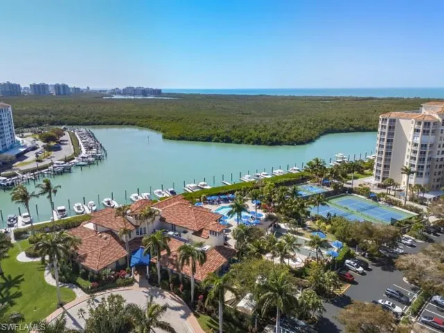 Drone / aerial view of a large body of water and a marina