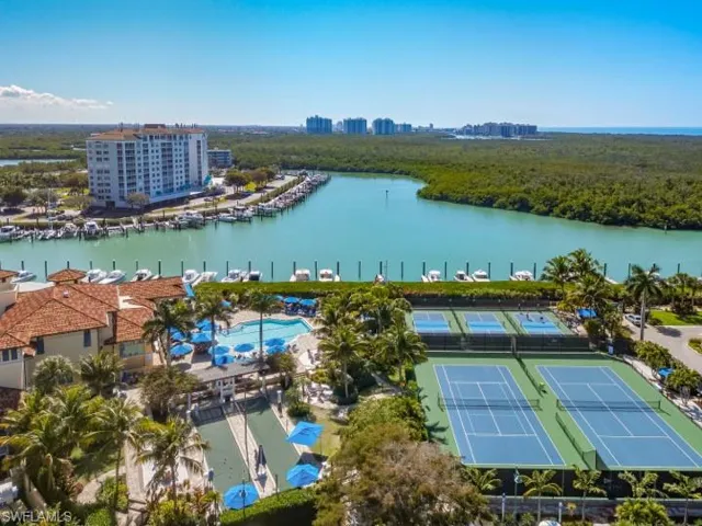 Bird's eye view of a nearby body of water and city skyline