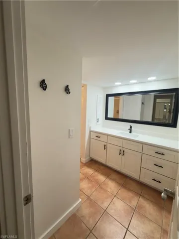 Bathroom featuring vanity and light tile patterned floors