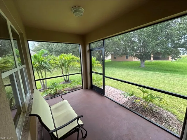 Sunroom featuring concrete flooring