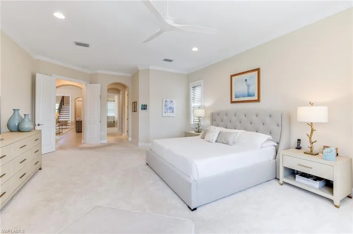 Primary bedroom with views to entrance & bath
