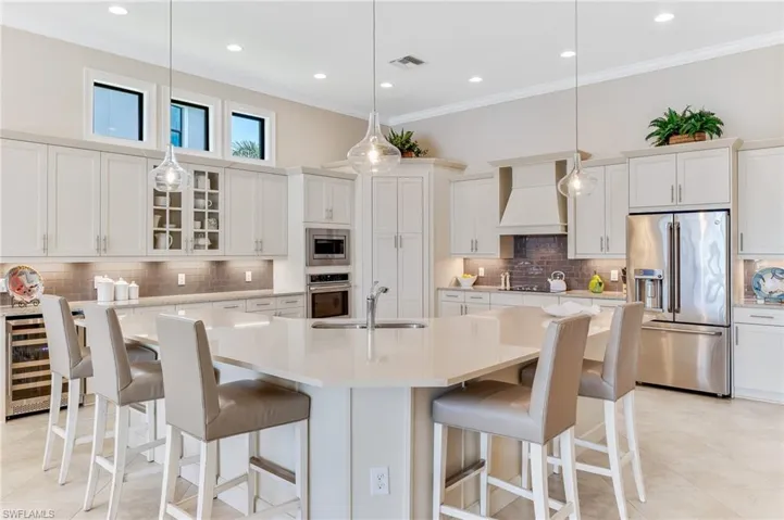 Kitchen to include wine refrigerator, center island