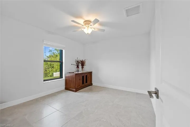 This large spare bedroom is one of three in the home. It has a large closet!