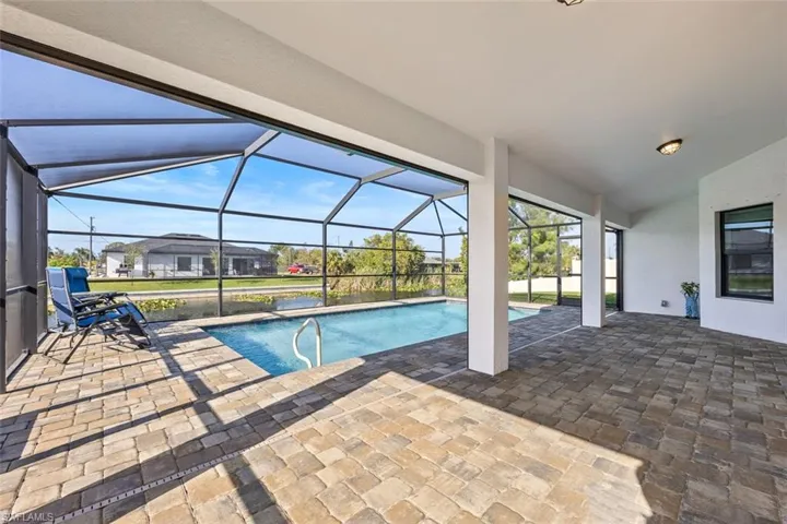 This oversized pavered lanai is perfect for lounging or entertaining. It has plenty of space for guests, and the pavers provide a comfortable surface to walk on.