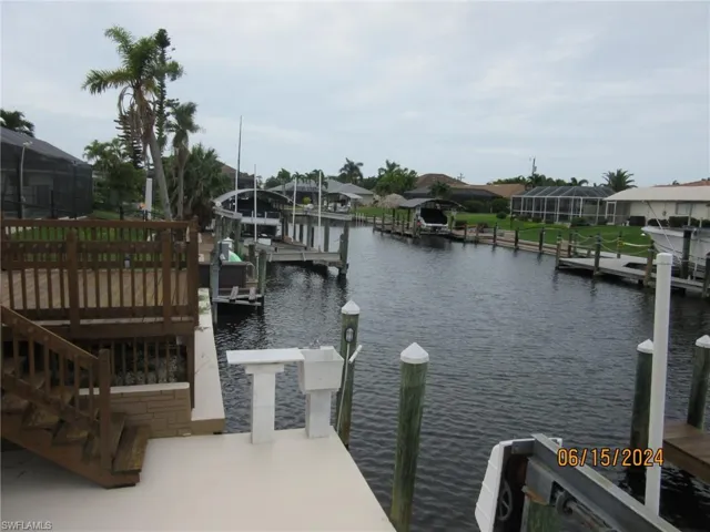 Dock area featuring a lanai and a water view
