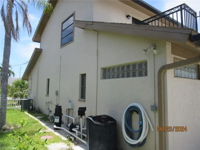 View of home's exterior with central AC unit