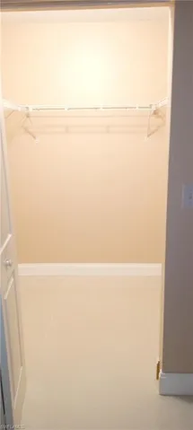 Spacious closet featuring tile patterned flooring