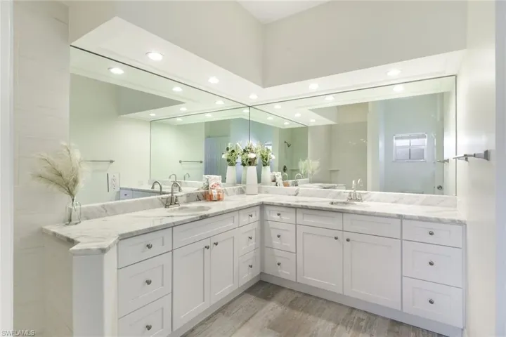 Large guest bath with hall and bedroom entries.