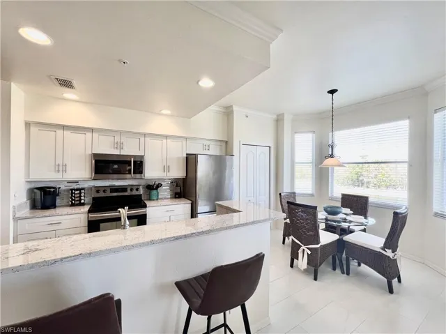 Kitchen with breakfast bar, eat in and pantry
