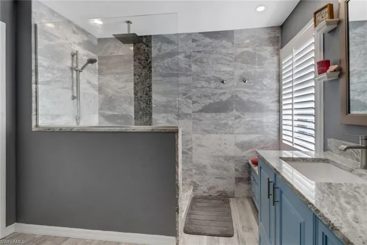 The bath has an abundance of storage areas