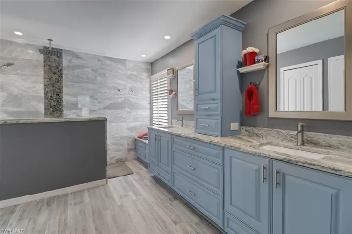 Once you see the primary bedroom's en suite bathroom you will be wowed by its spaciousness, extra storage and upgraded features!