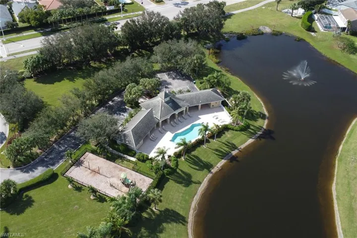Aerial view shows community pool and features a water view