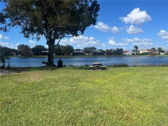 Community picnic/barbecue area with a water view