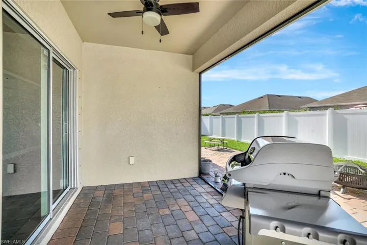Sunroom with a ceiling fan