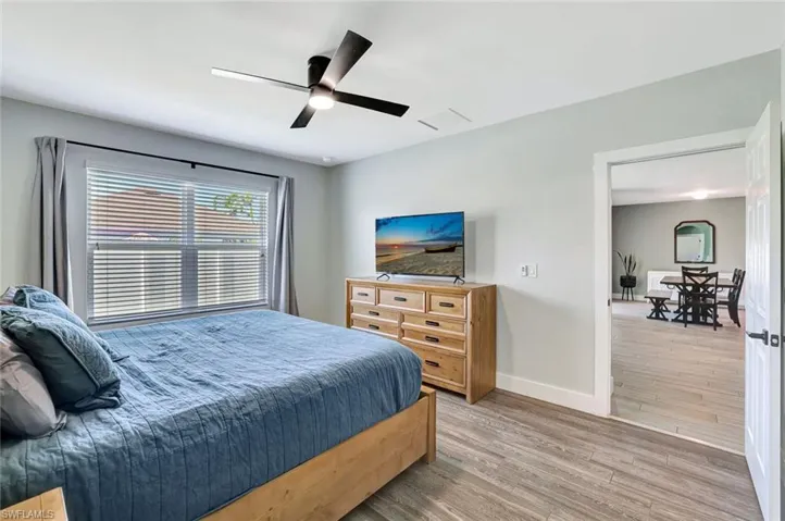 Bedroom featuring light wood-style flooring and a ceiling fan