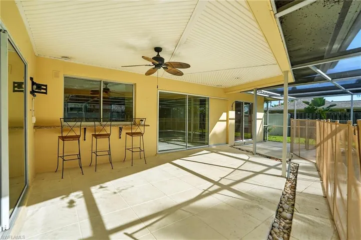 View of patio / terrace with glass enclosure and ceiling fan