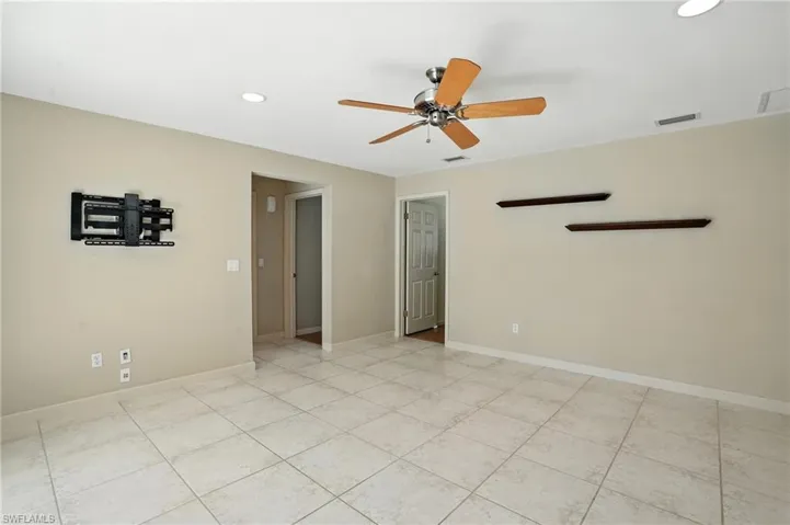 Spare room with recessed lighting, a ceiling fan, and light tile patterned floors
