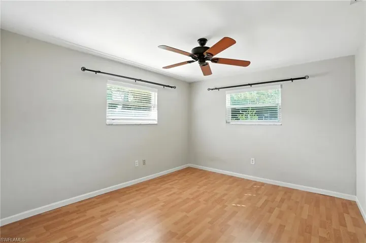 Unfurnished room featuring light wood finished floors and ceiling fan