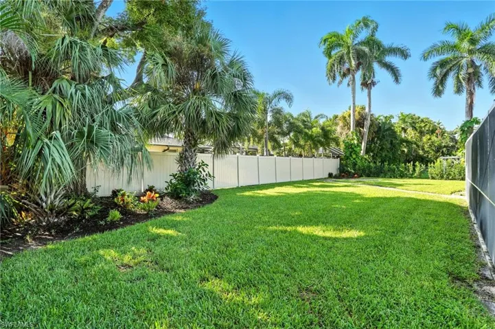 View of fenced backyard