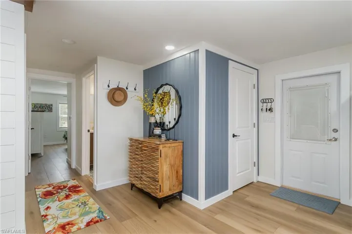 Foyer featuring light wood-style flooring and recessed lighting