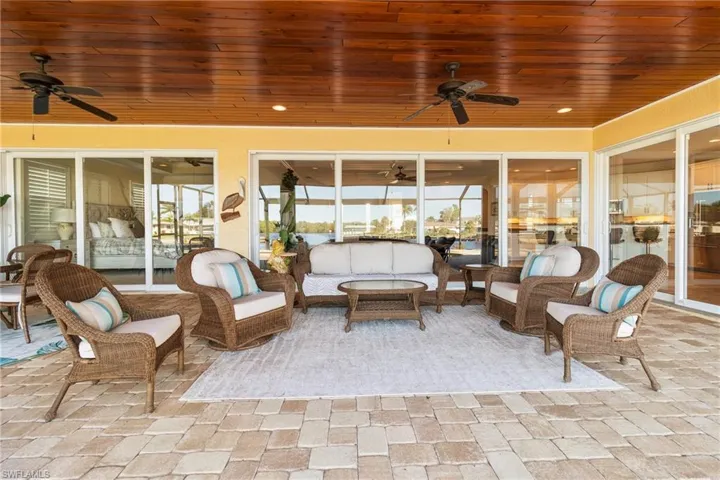 Sunroom / solarium with plenty of natural light and wood ceiling