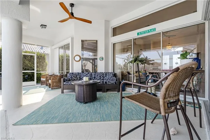 Sunroom / solarium featuring ceiling fan