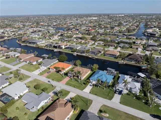 Aerial view with a water view and a residential view