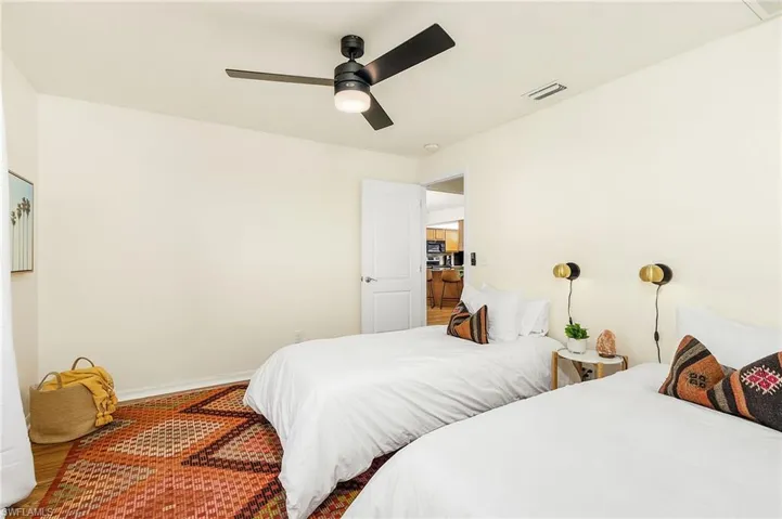 Bedroom featuring a ceiling fan and wood finished floors