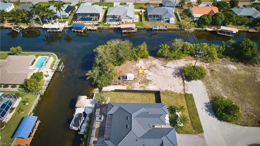 Waterfront lot with canal access, surrounded by established residences