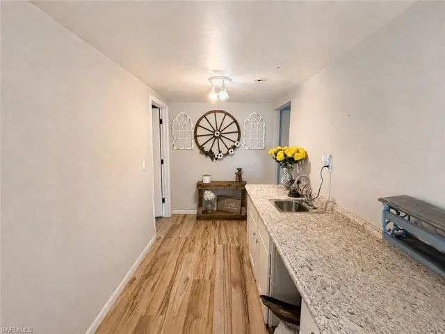 Upstairs Main Hallway with Cabinet/Countertop + Sink