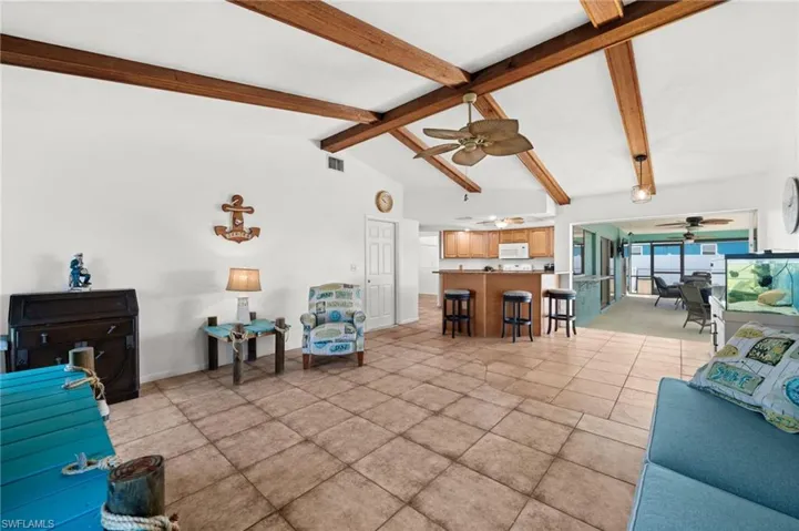 Open Family Room looking toward the Kitchen and Pool