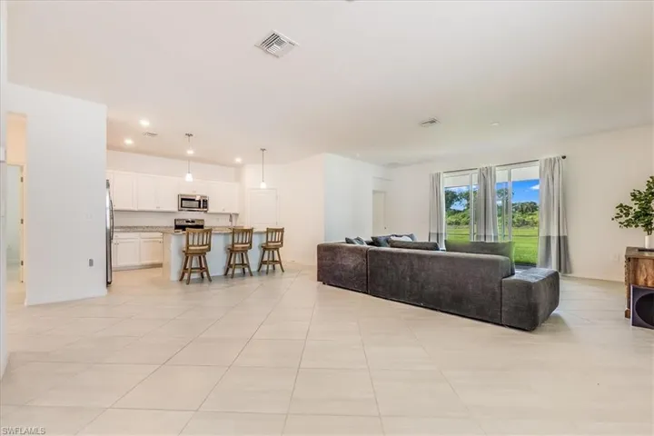 Living room featuring kitchen and patio.