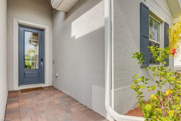 View of property entrance with gorgeous front door.