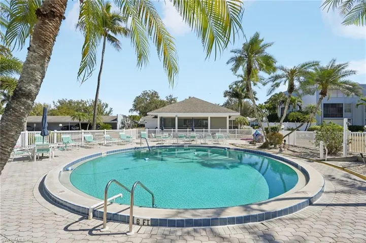Community pool with a patio