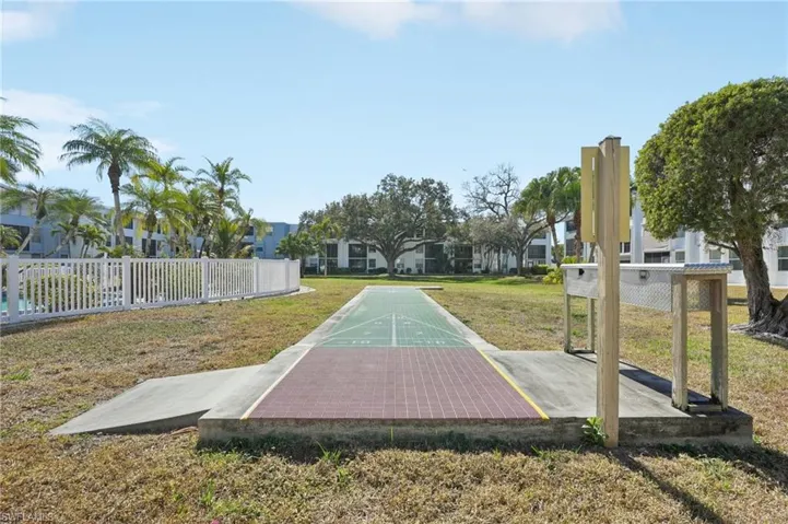 View of property's community with shuffleboard