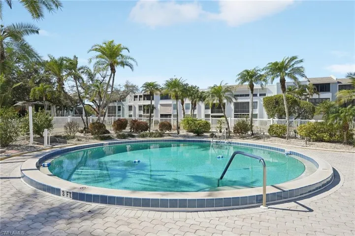 Community pool with a patio area
