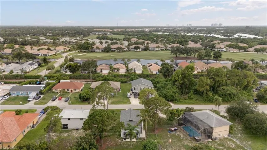 Residential area featuring a variety of single-story and multi-story homes, many with screened pools