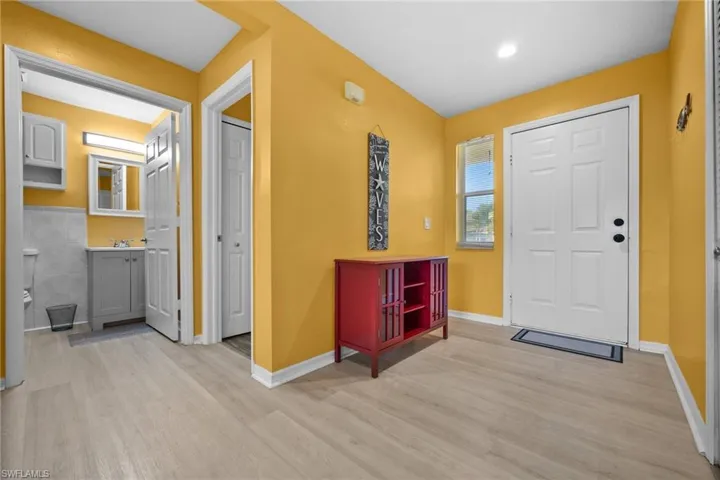 Entrance foyer with light hardwood / wood-style floors
