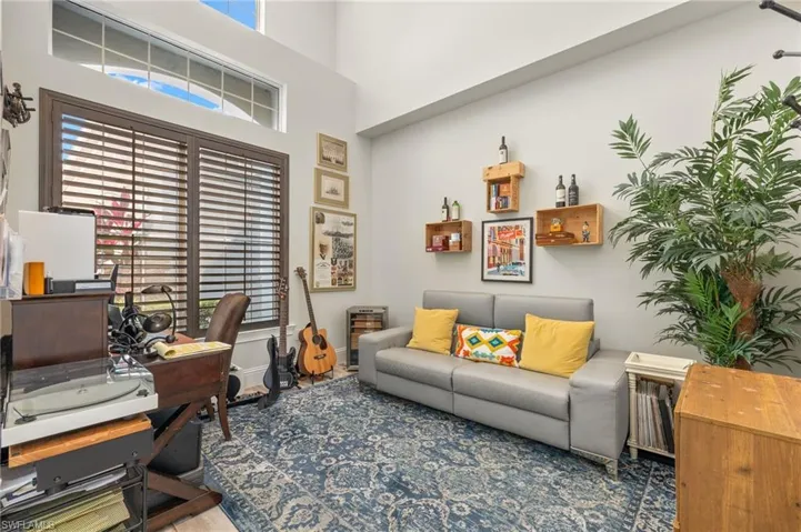 Office featuring plenty of natural light and a high ceiling