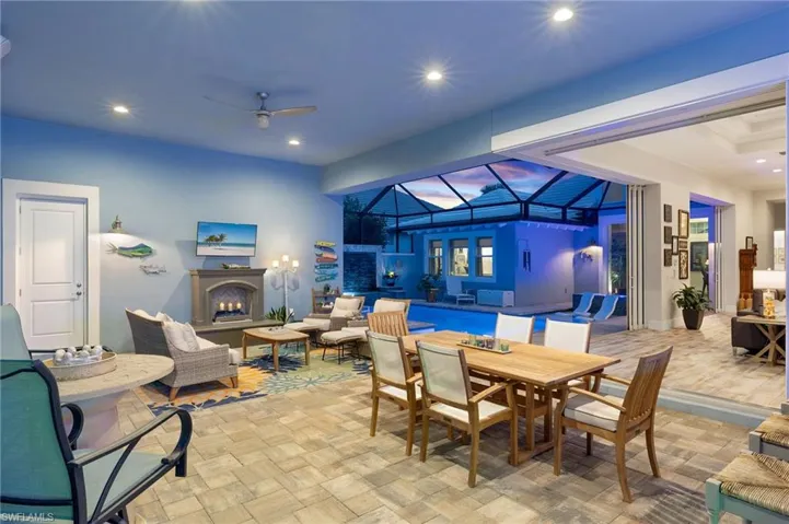 Tiled dining space featuring ceiling fan