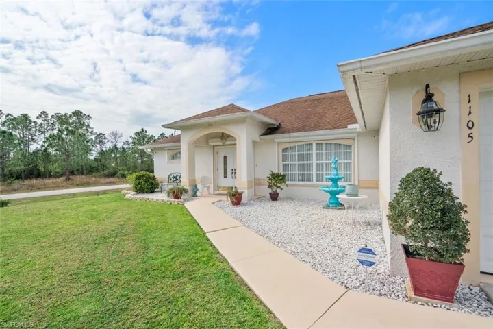 Property entrance with a yard
